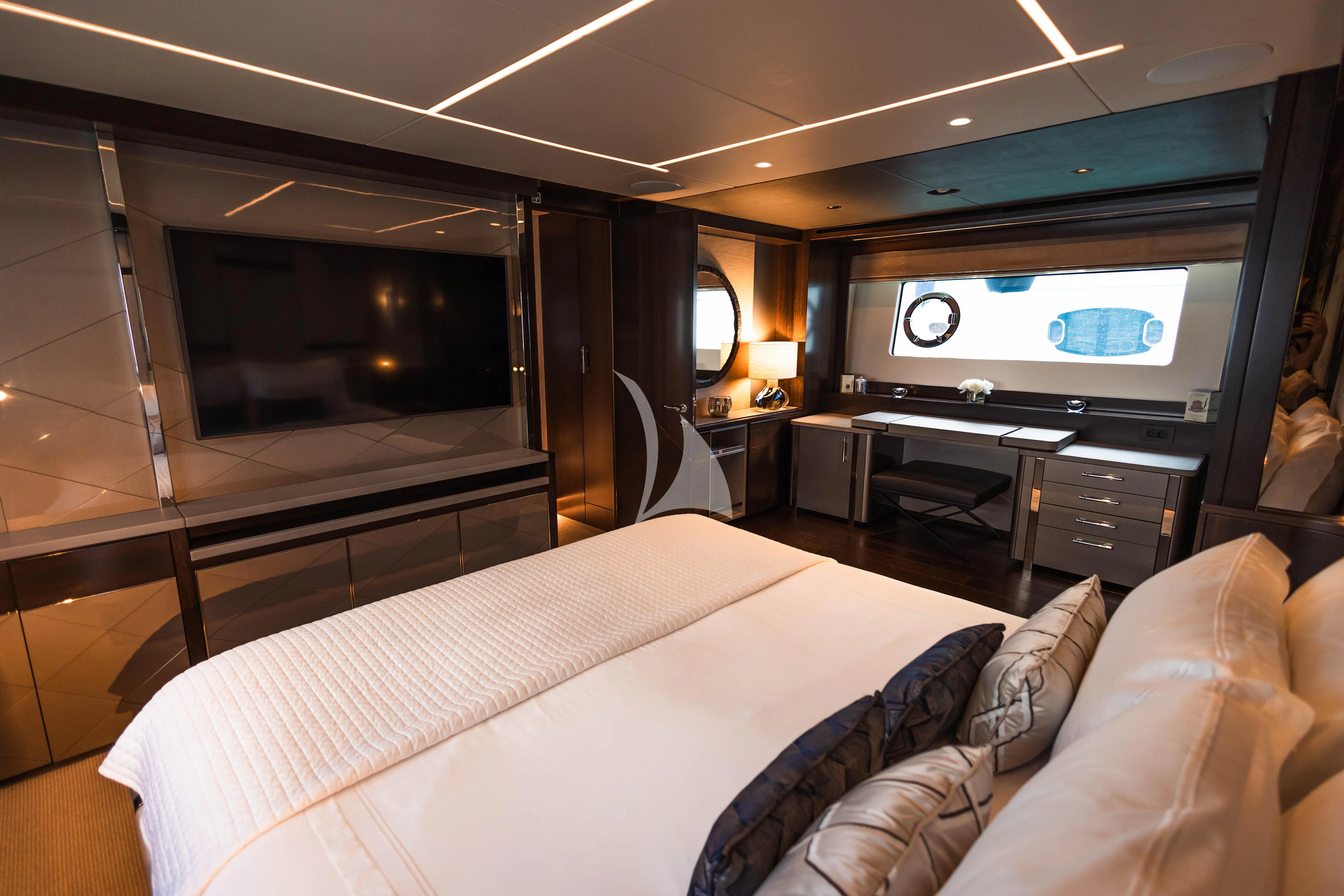 a hotel room with a bed and tv aboard MOONLIGHT Yacht for Sale