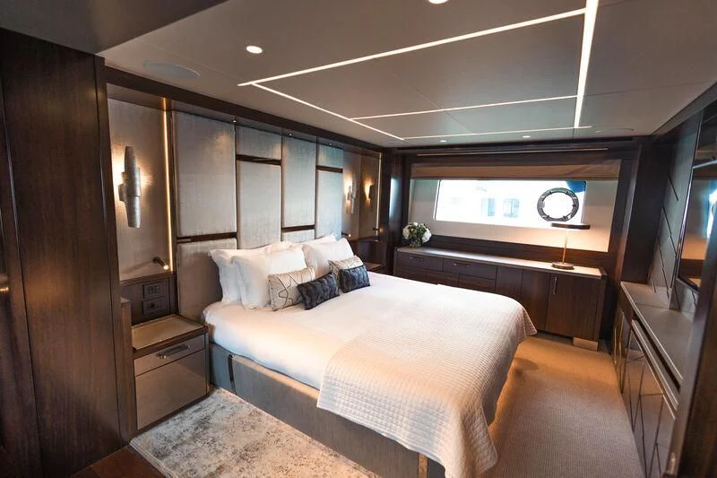 a room with a bed and a desk aboard MOONLIGHT Yacht for Sale