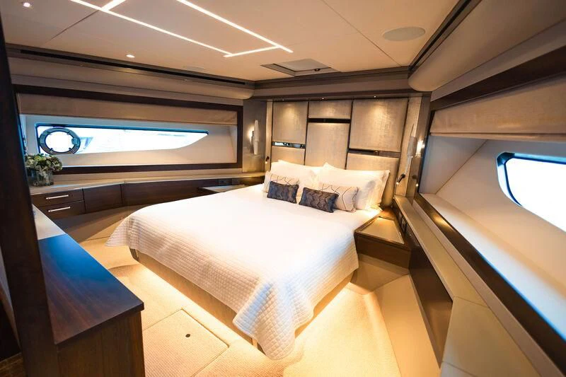 a room with a bed and a television aboard MOONLIGHT Yacht for Sale