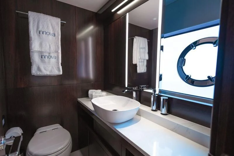 a bathroom with a sink and a mirror aboard MOONLIGHT Yacht for Sale