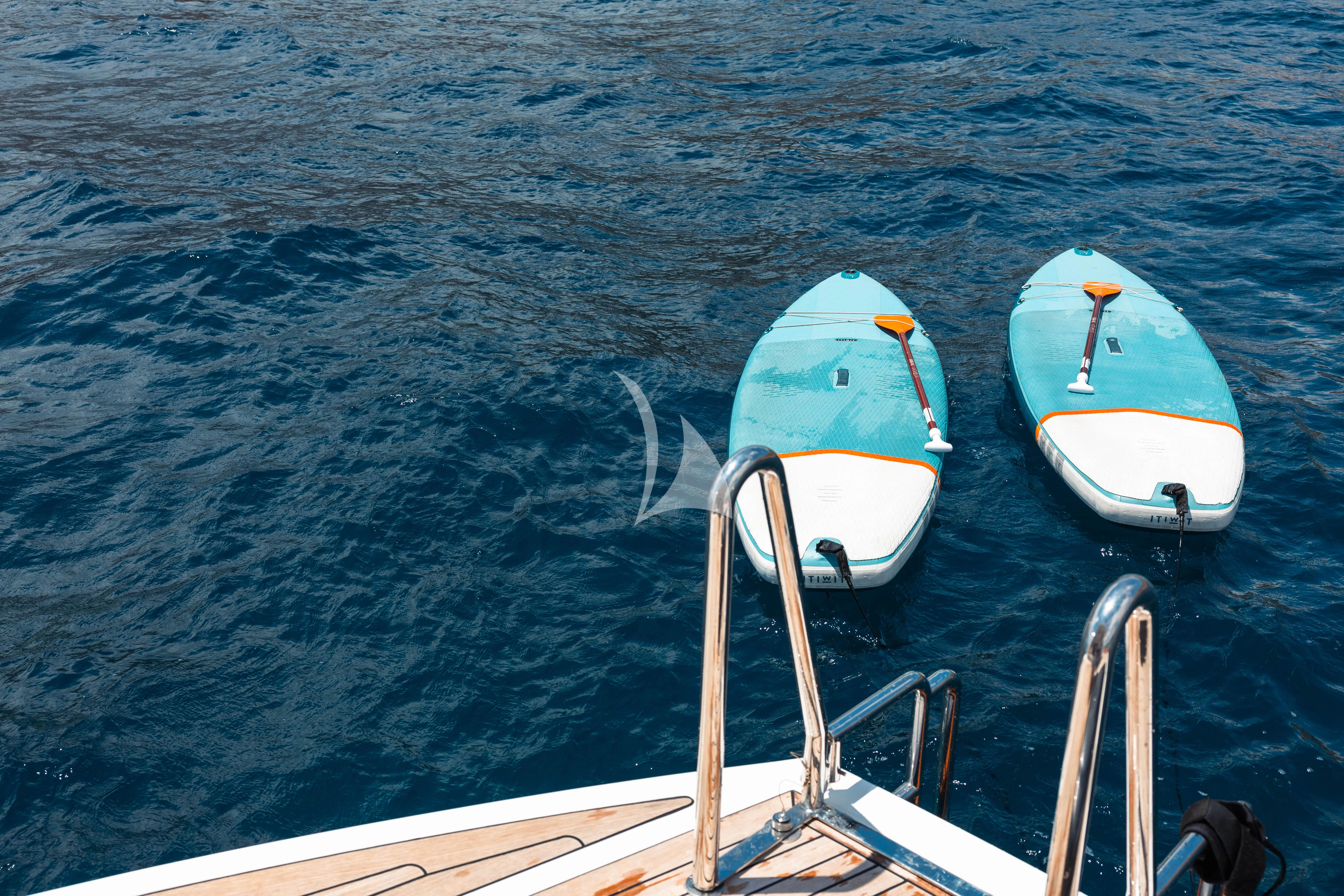 a couple of boats sit in the water aboard MOONLIGHT Yacht for Sale