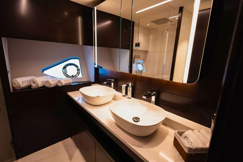 a bathroom with sinks and mirrors aboard MOONLIGHT Yacht for Sale
