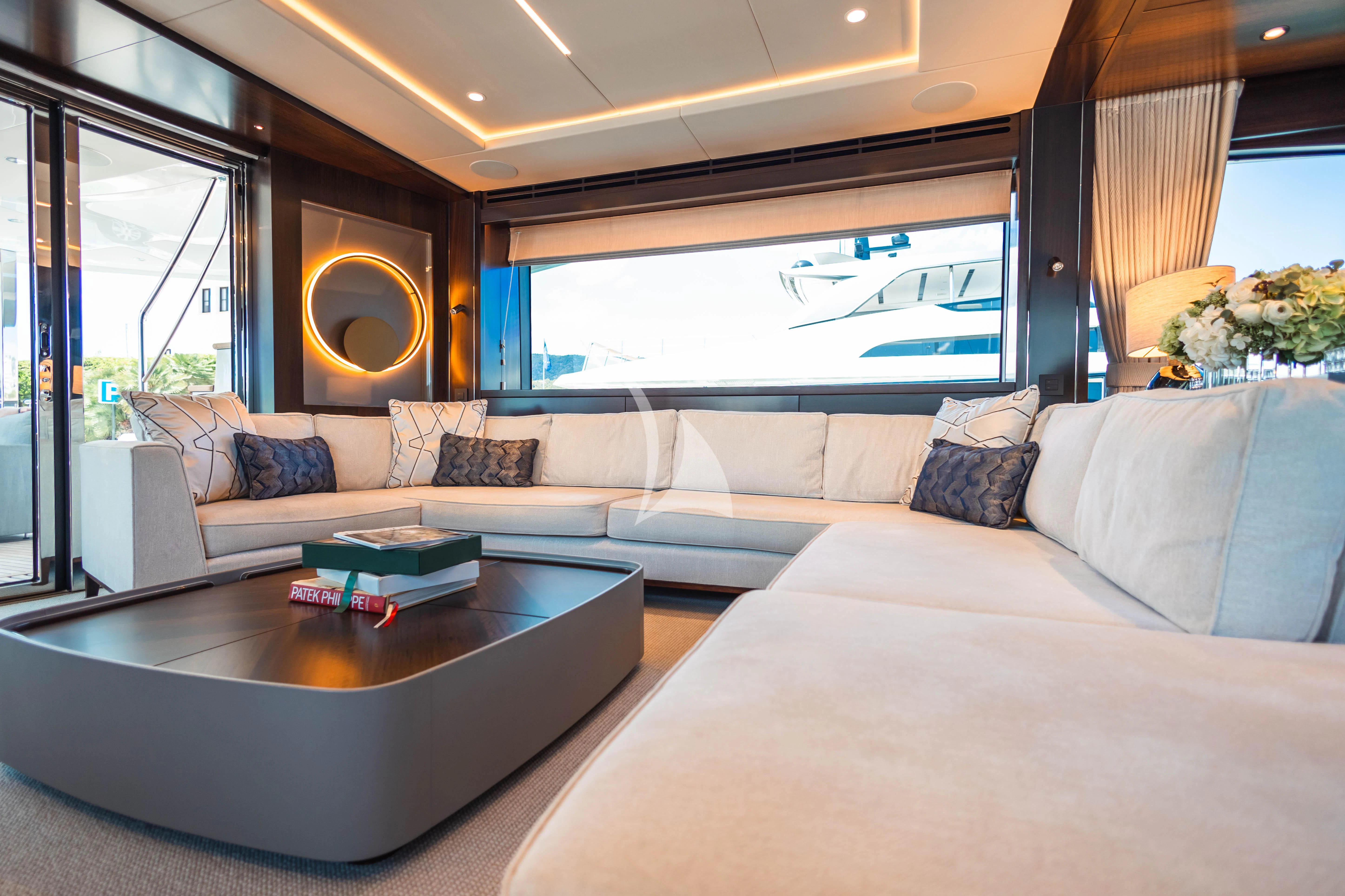 a living room with a couch and a table aboard MOONLIGHT Yacht for Sale