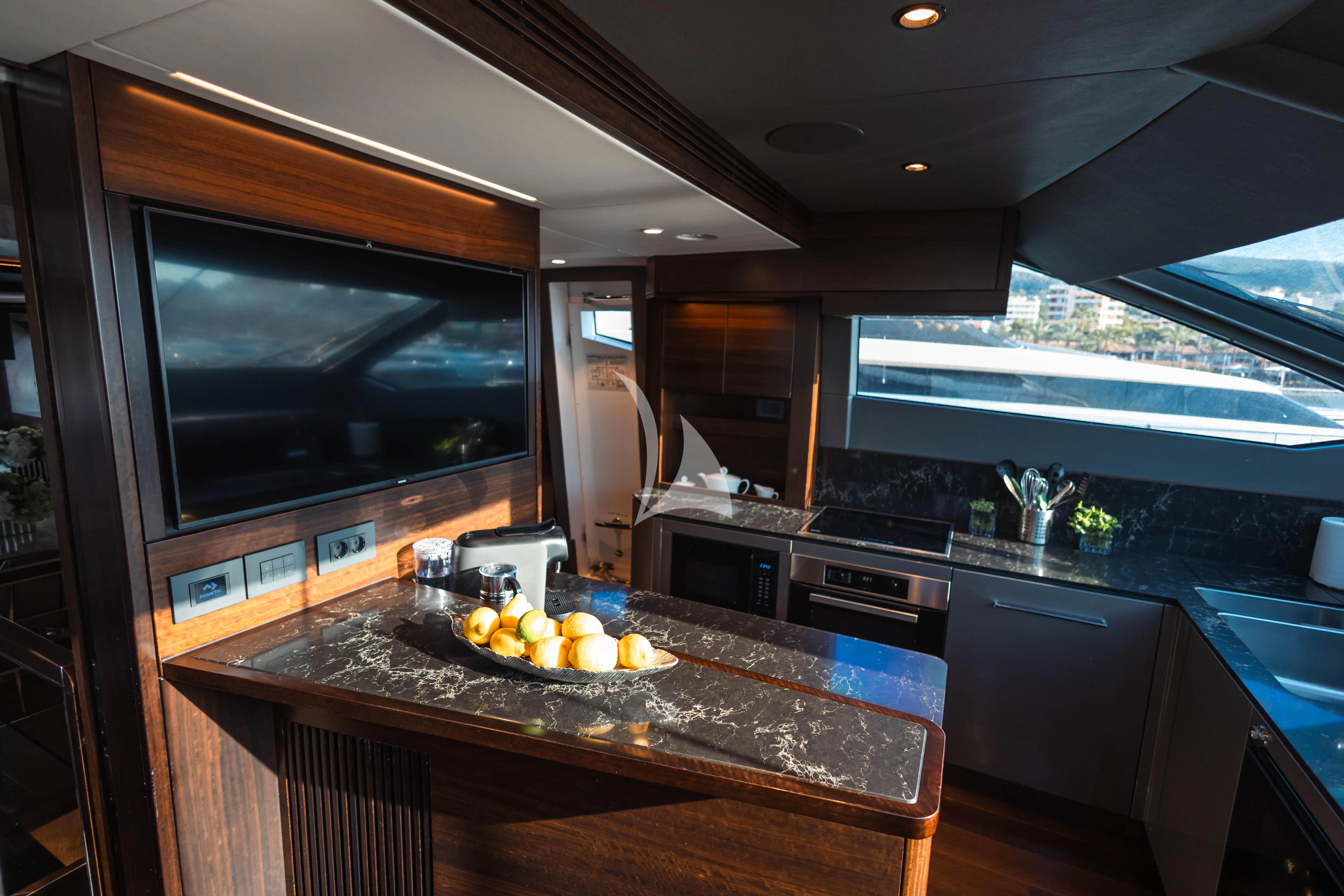 a kitchen with a large island aboard MOONLIGHT Yacht for Sale