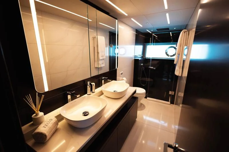 a bathroom with a sink and a mirror aboard MOONLIGHT Yacht for Sale