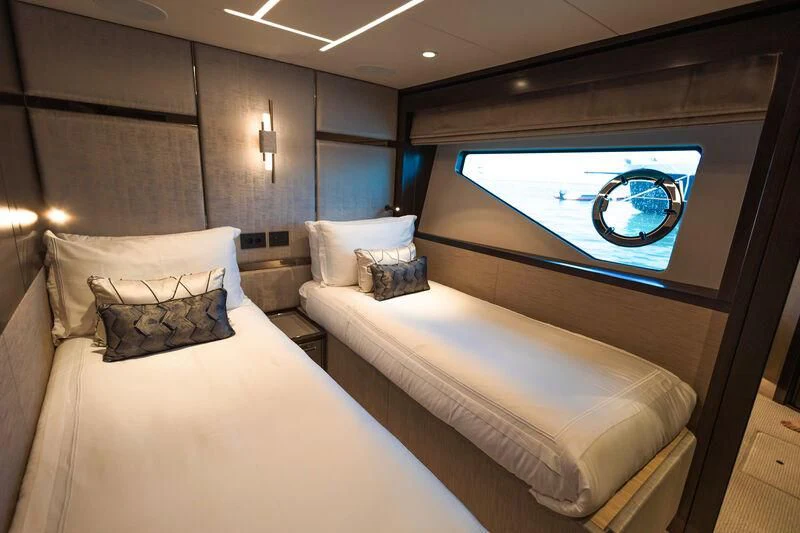 a bed with a large mirror above it aboard MOONLIGHT Yacht for Sale