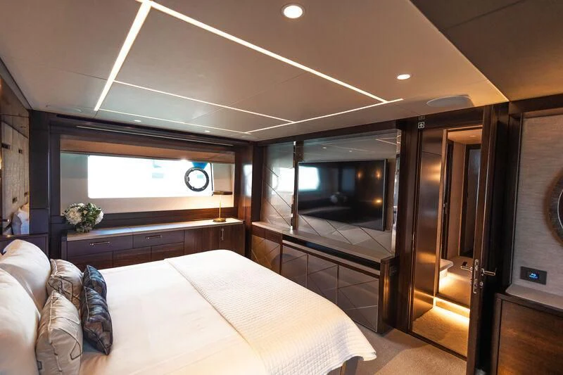 a bedroom with a large mirror aboard MOONLIGHT Yacht for Sale