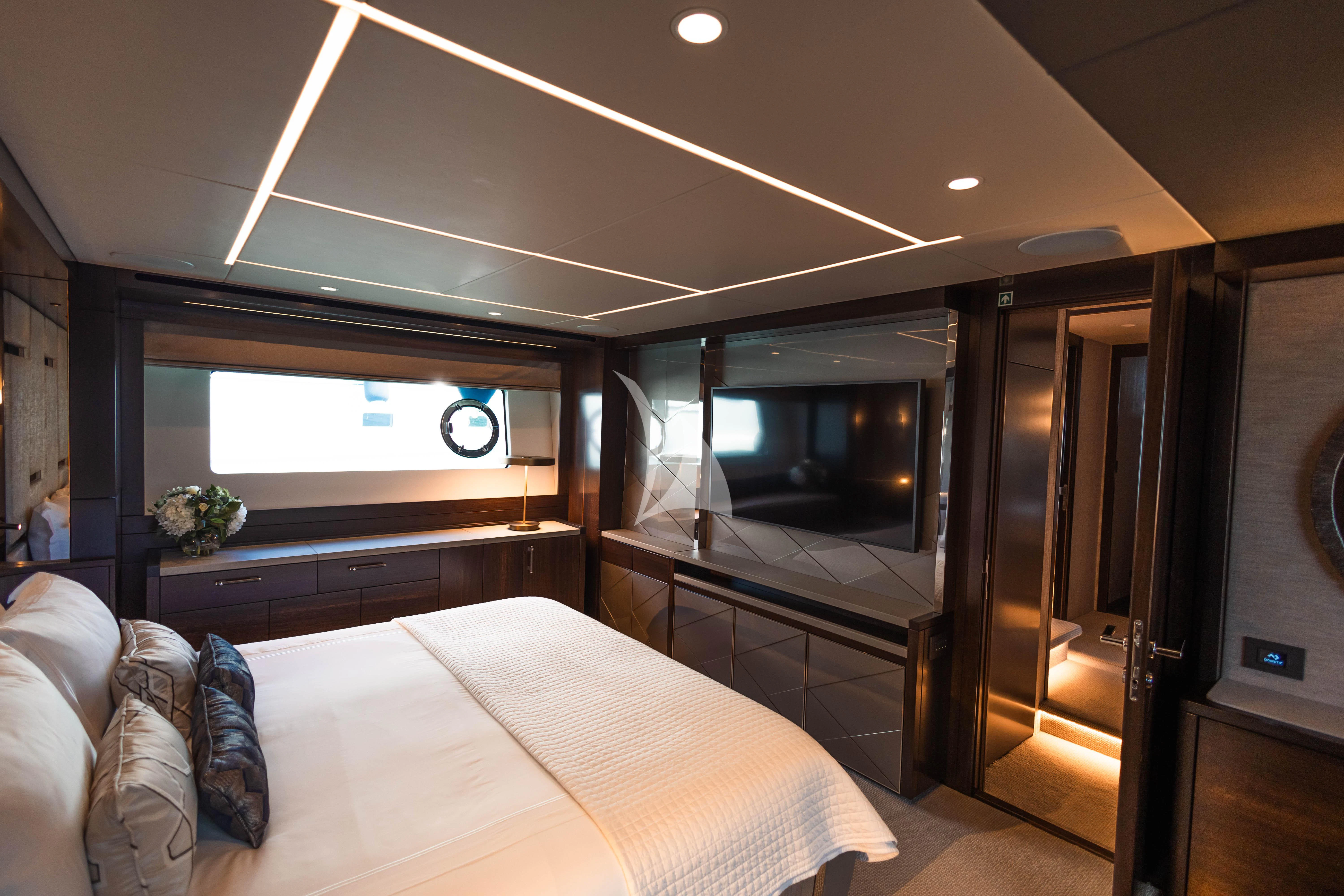 a bedroom with a large mirror aboard MOONLIGHT Yacht for Sale
