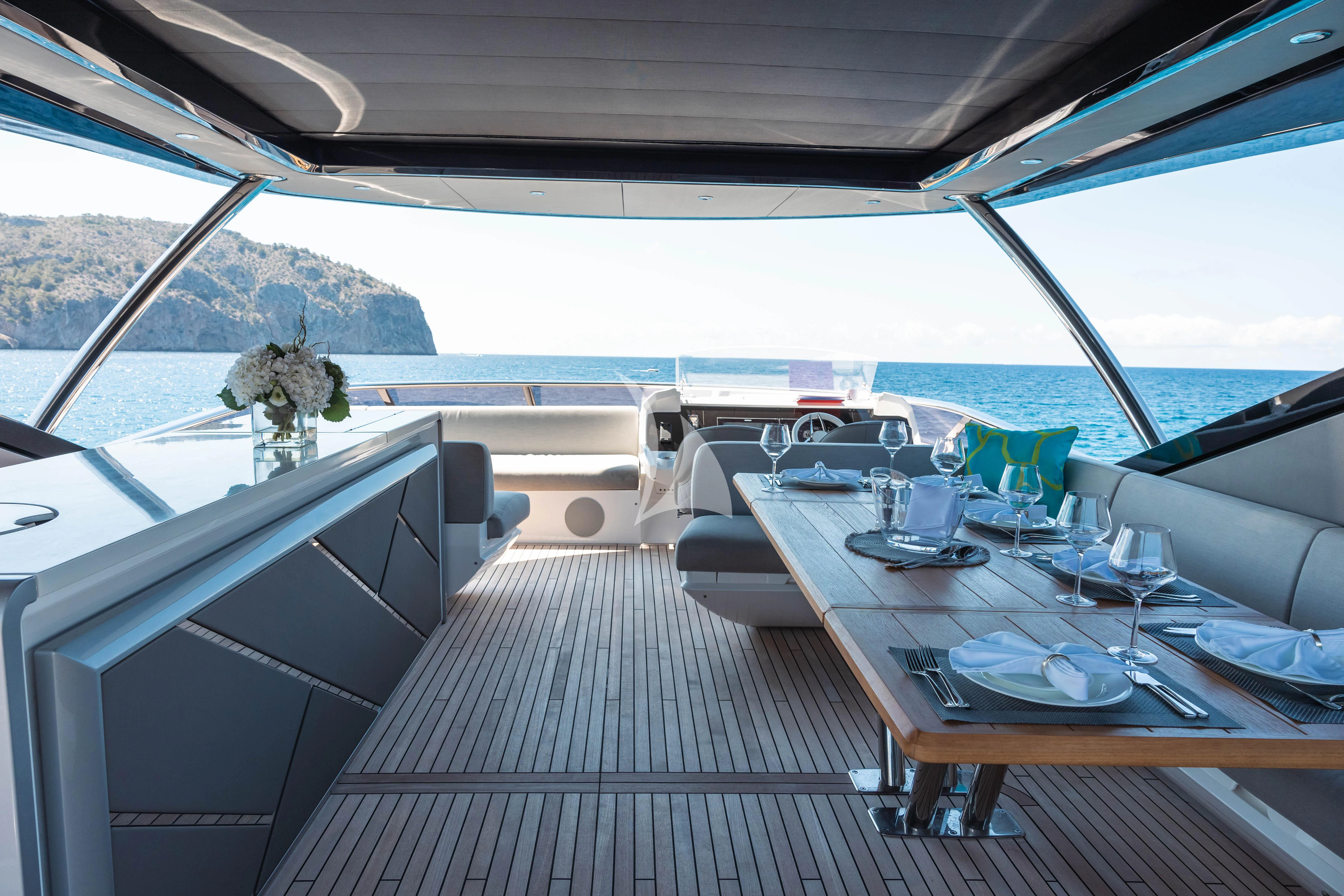 a table and chairs on a boat aboard MOONLIGHT Yacht for Sale