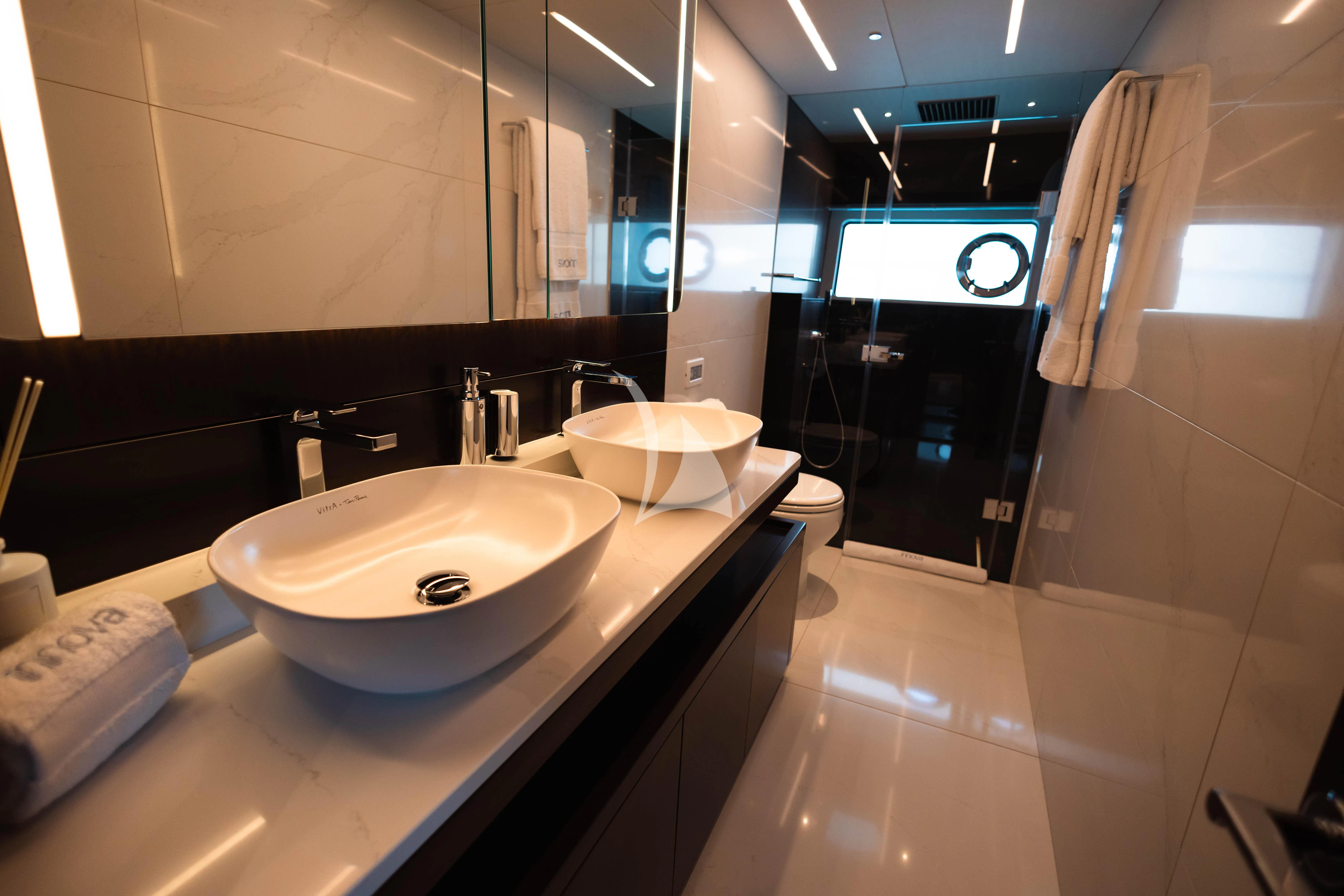 a bathroom with a sink and bathtub aboard MOONLIGHT Yacht for Sale