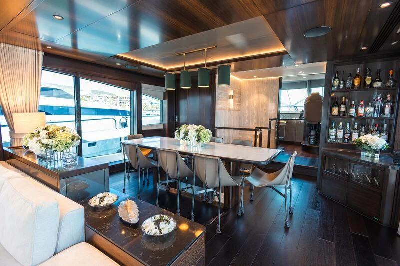 a room with a table and chairs aboard MOONLIGHT Yacht for Sale