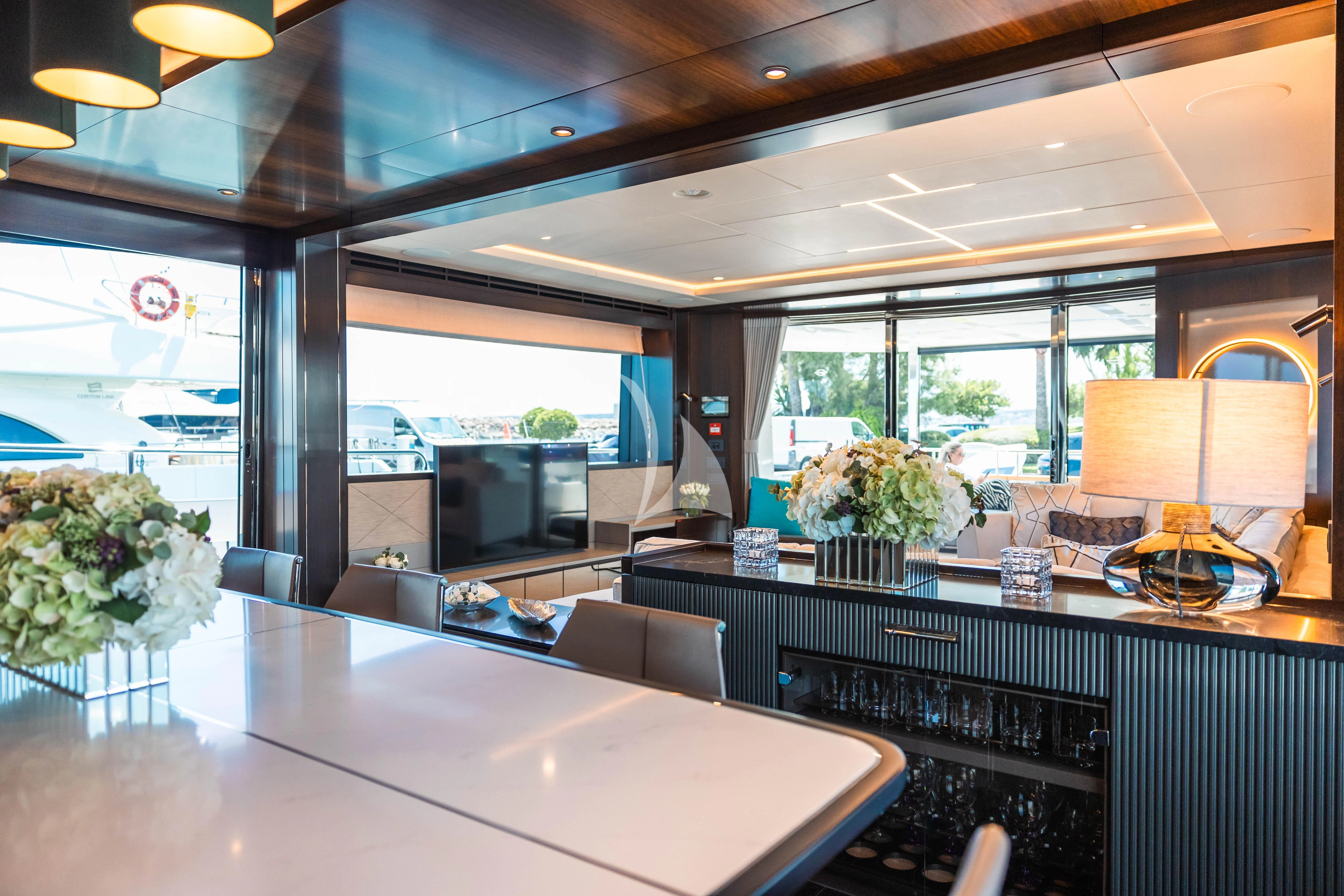a room with a table and chairs aboard MOONLIGHT Yacht for Sale