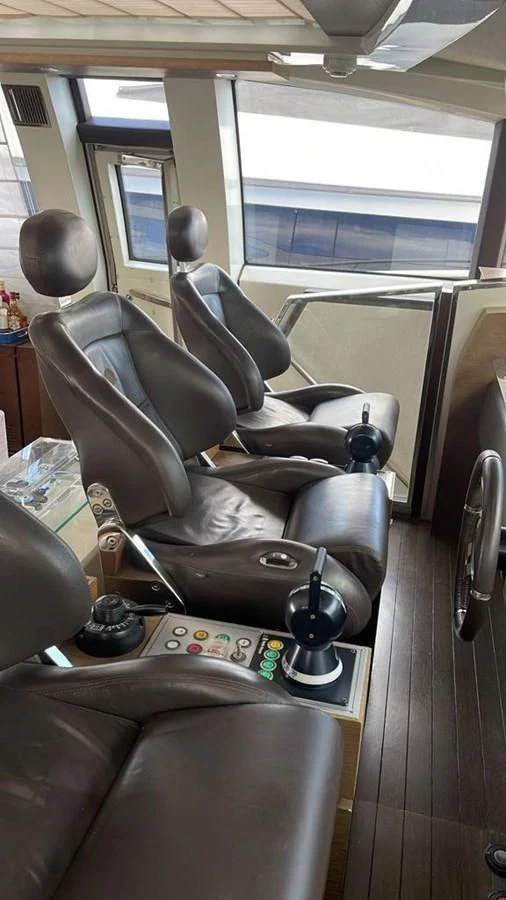a leather chair in a train aboard DUKE Yacht for Sale