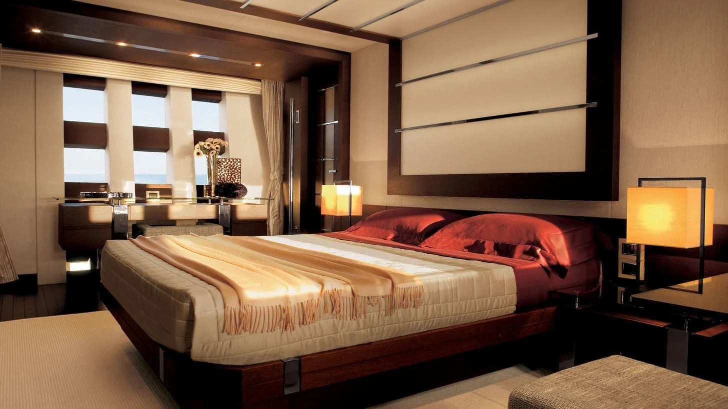 a large bed in a hotel room aboard DUKE Yacht for Sale