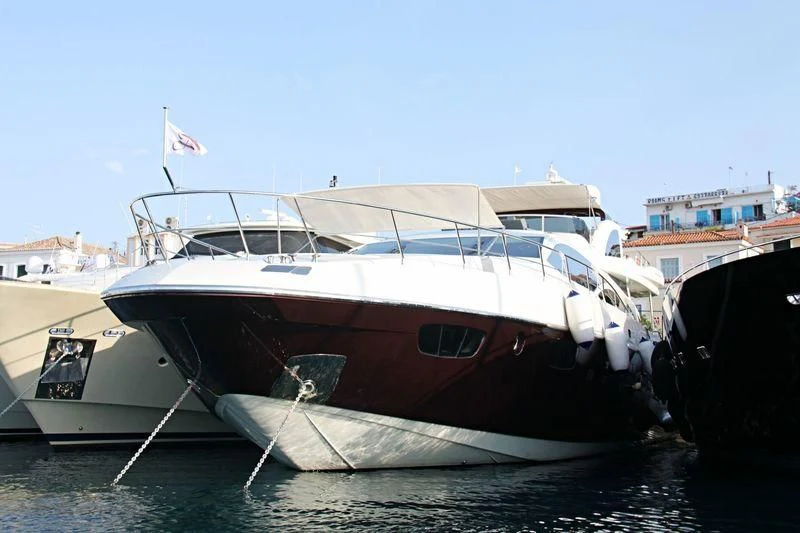a boat docked at a pier aboard DUKE Yacht for Sale