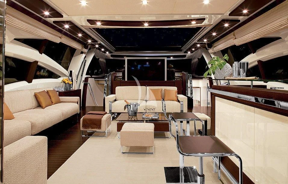 a room with a couch and a table aboard DUKE Yacht for Sale