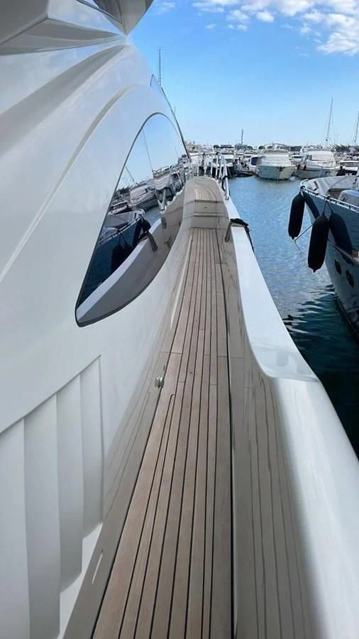 a long dock with boats aboard DUKE Yacht for Sale