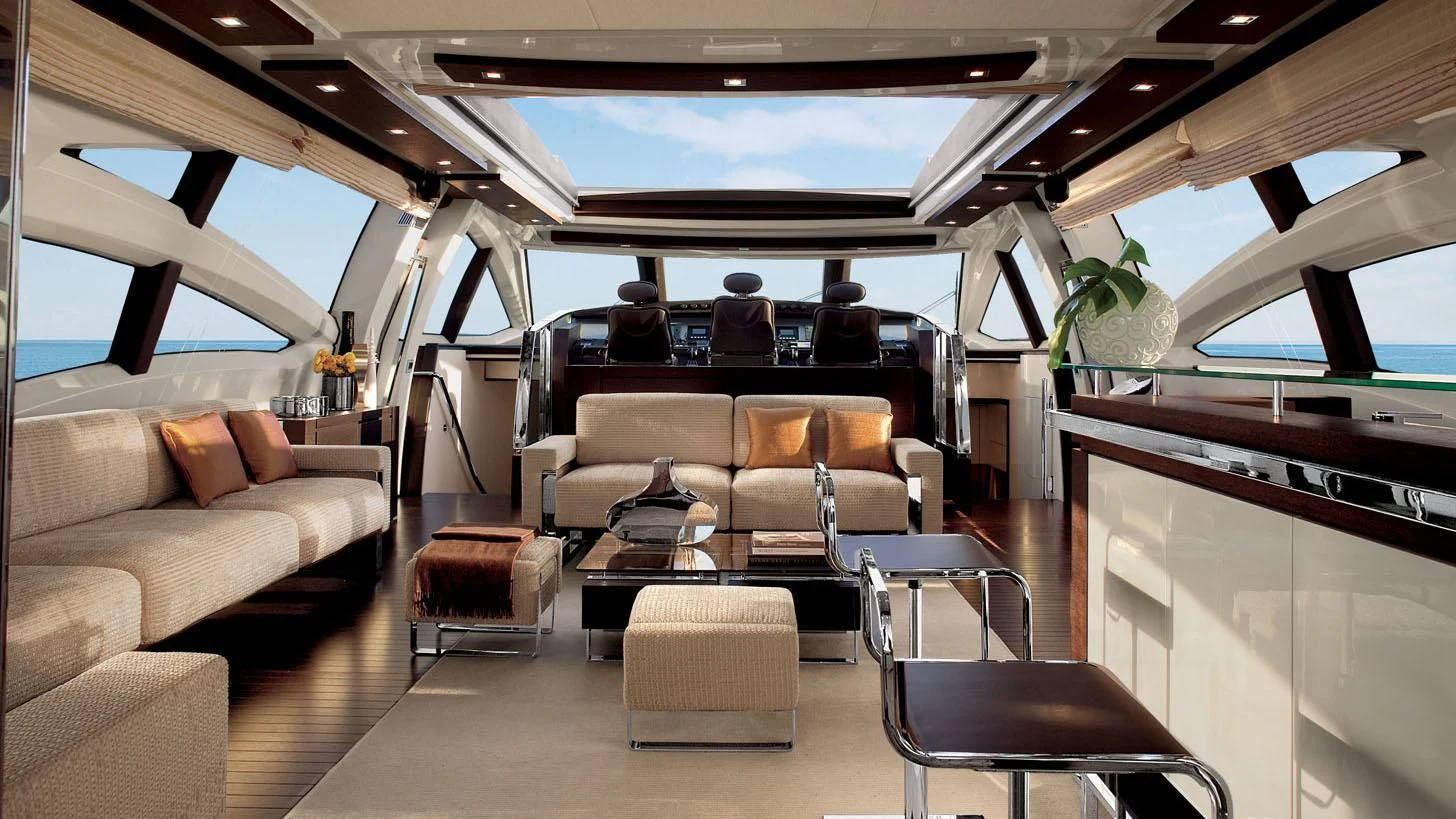 a train with a couch and a coffee table aboard DUKE Yacht for Sale