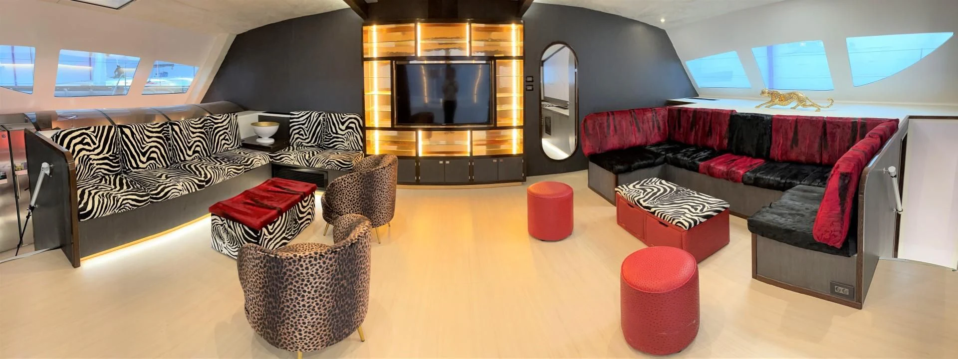 a living room with a couch and a tv aboard SKYE Yacht for Sale