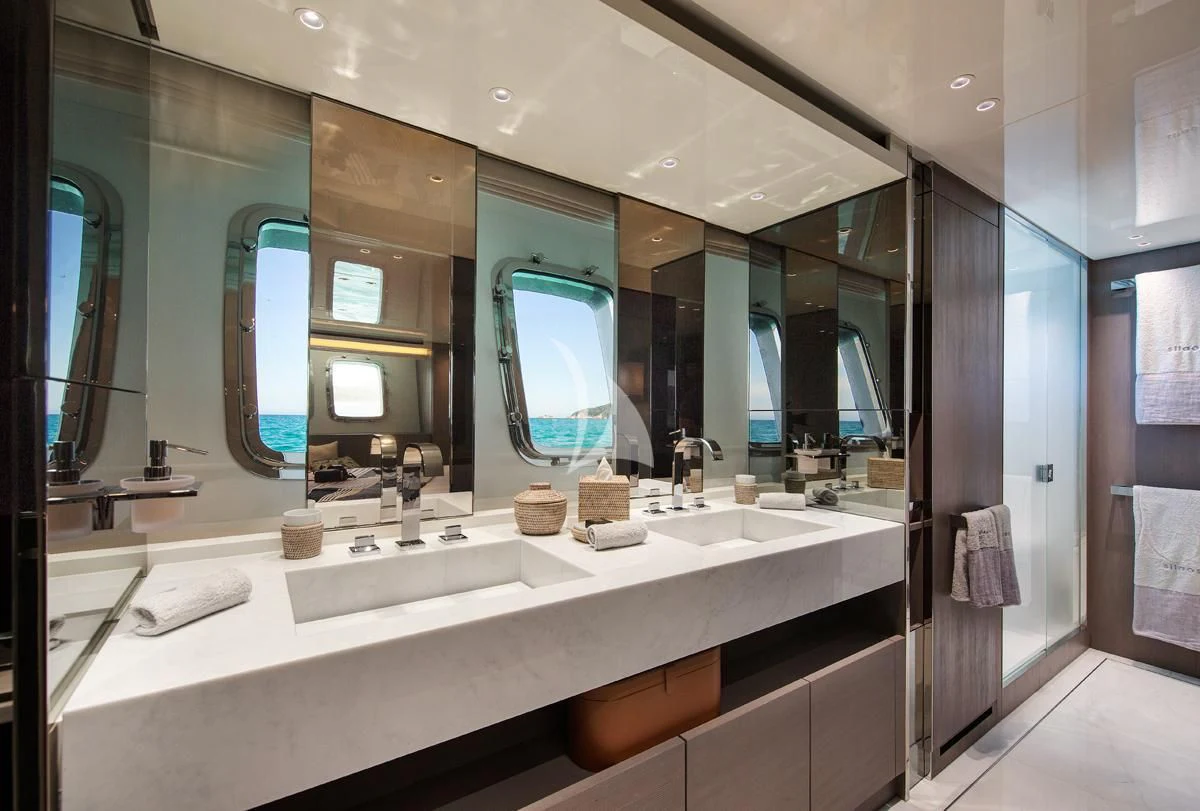 a bathroom with a large mirror aboard VINCI II Yacht for Sale