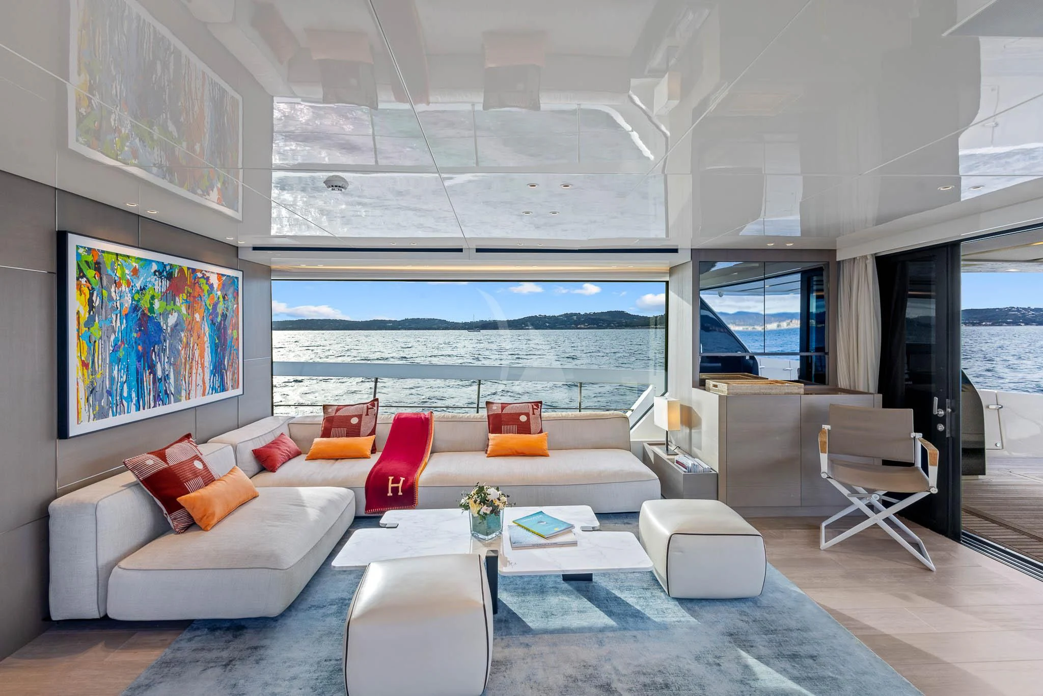 a living room with a large window aboard VINCI II Yacht for Sale