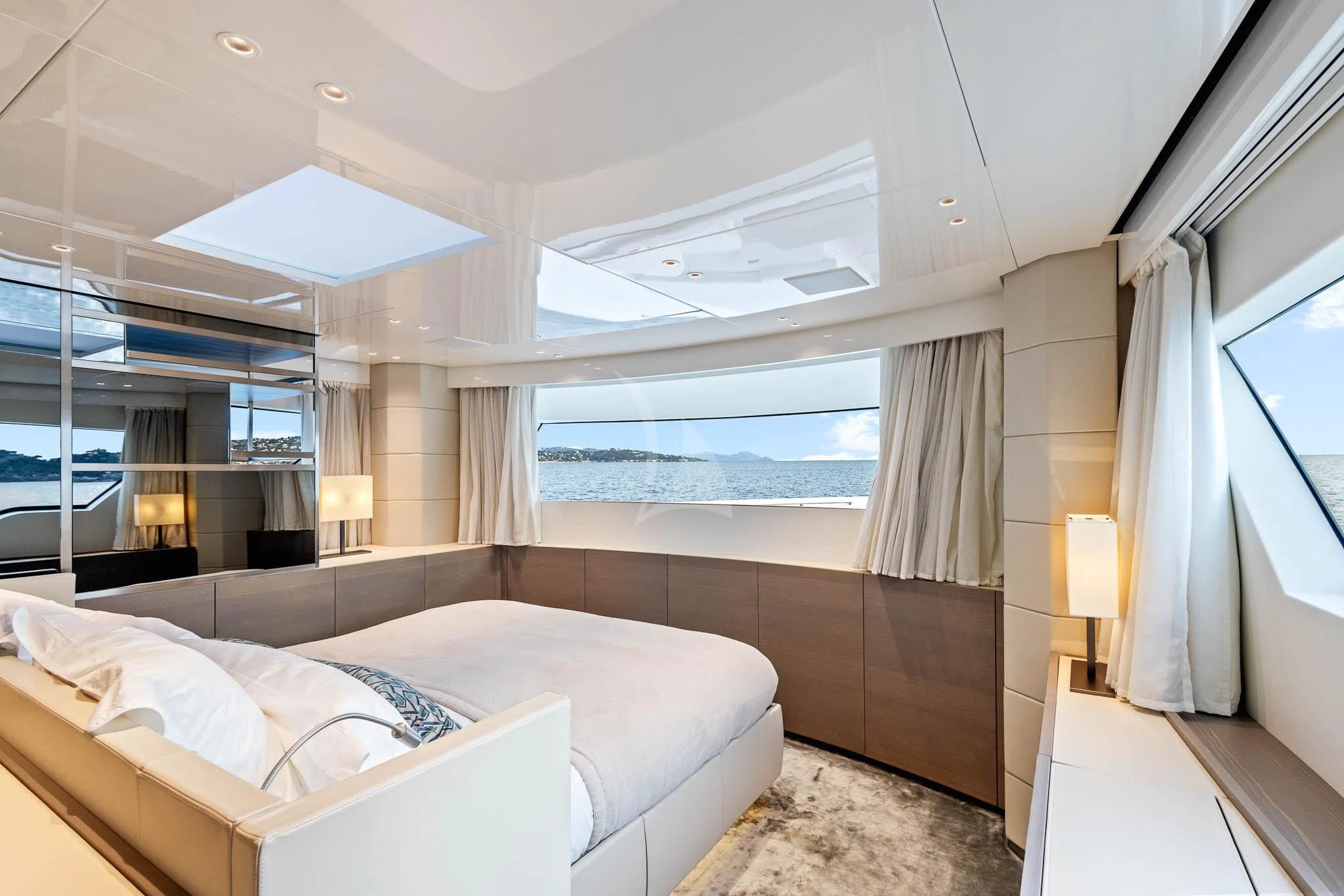 a room with a bed and a window aboard VINCI II Yacht for Sale