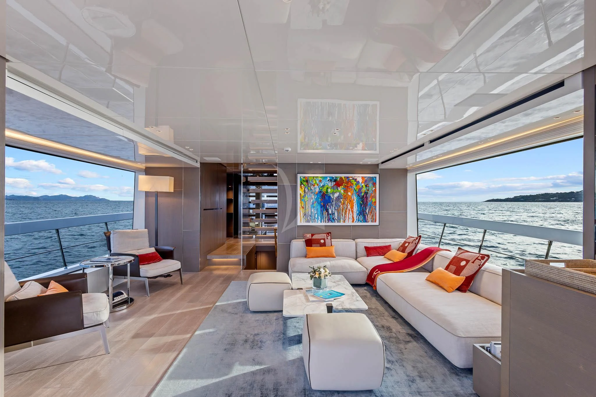 a living room with a large window aboard VINCI II Yacht for Sale