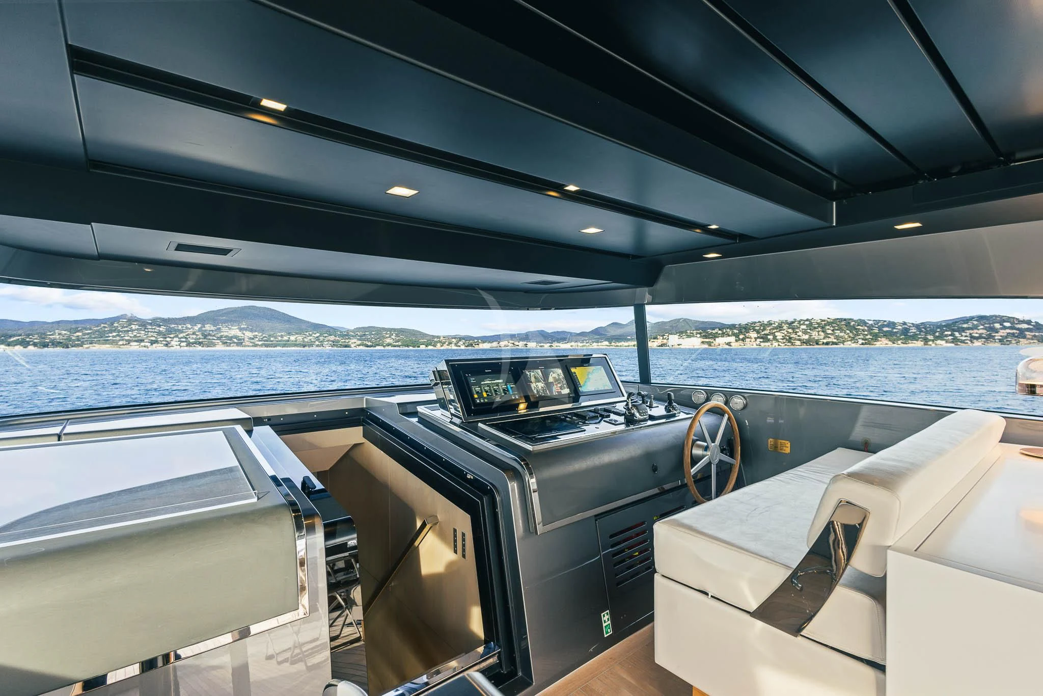a boat with a view of the water and land below aboard VINCI II Yacht for Sale