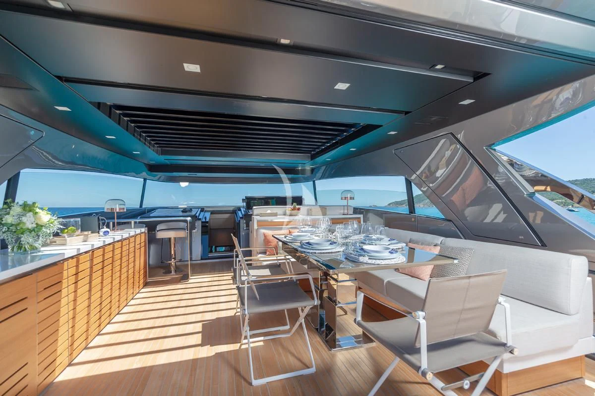a room with a table and chairs aboard VINCI II Yacht for Sale