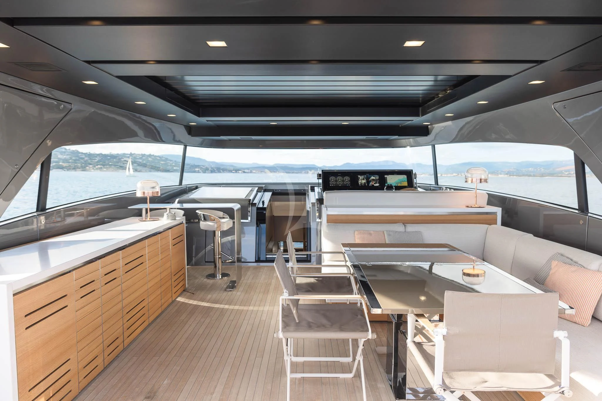 a room with a table and chairs aboard VINCI II Yacht for Sale