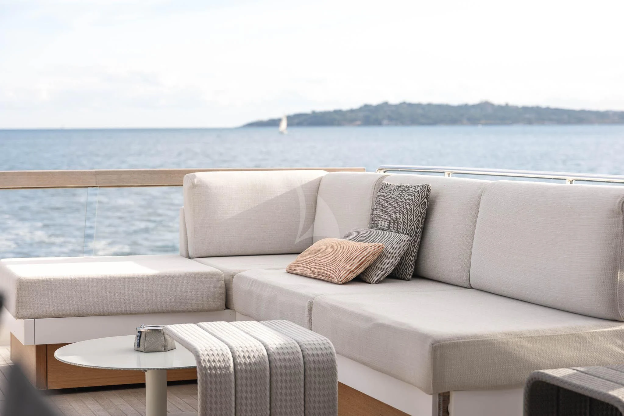 a couch with pillows on it aboard VINCI II Yacht for Sale