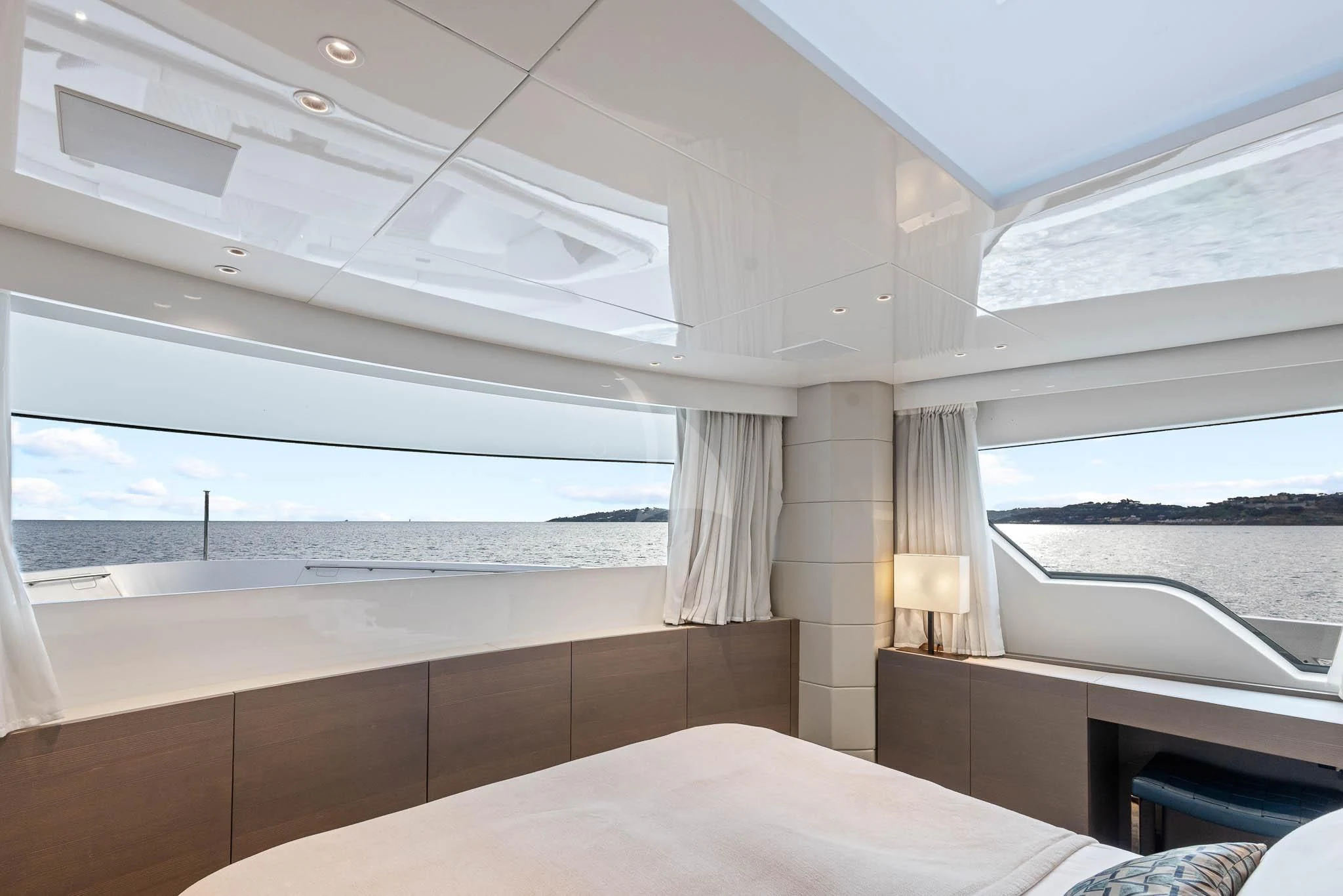 a room with a bed and a window aboard VINCI II Yacht for Sale