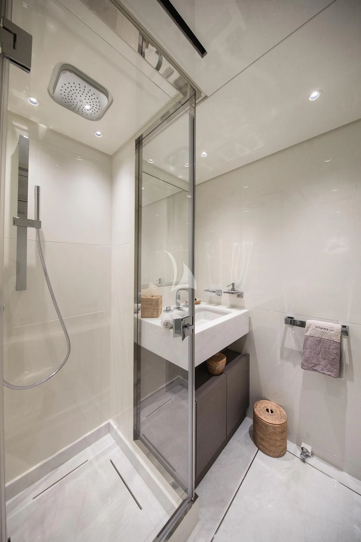 a bathroom with a glass shower aboard VINCI II Yacht for Sale