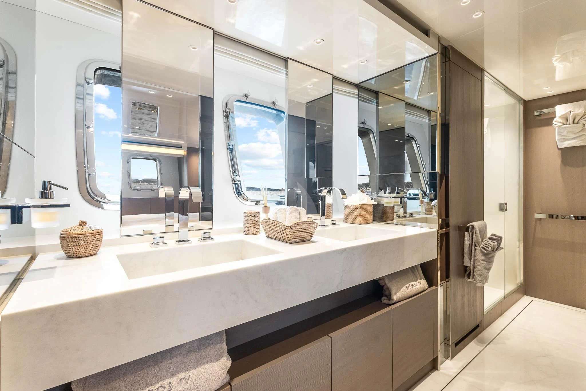 a bathroom with a large mirror aboard VINCI II Yacht for Sale