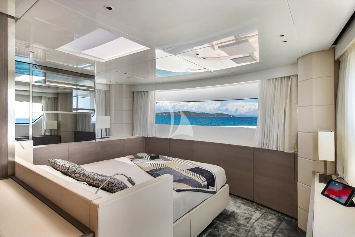a room with a bed and a window aboard VINCI II Yacht for Sale