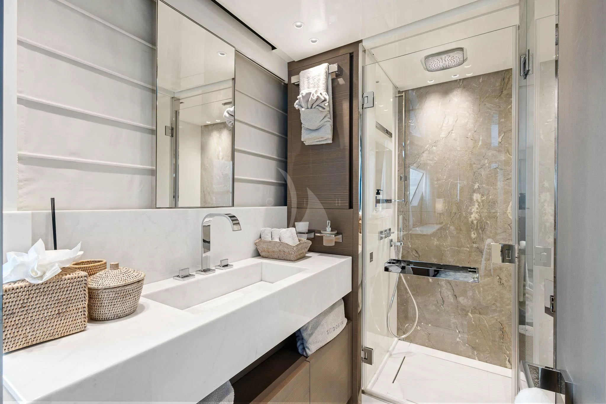 a bathroom with a glass shower aboard VINCI II Yacht for Sale