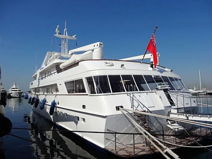 a large white boat with a red flag on it aboard VARMAR VE Yacht for Sale