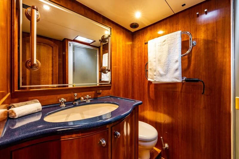 a bathroom with a sink and a mirror aboard BOLERO Yacht for Sale