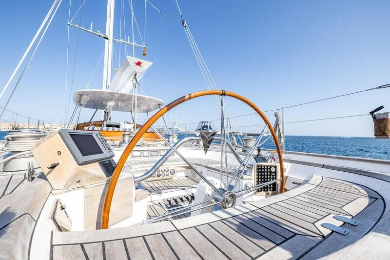 a large white boat on a dock aboard BOLERO Yacht for Sale