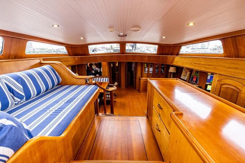 a room with wooden furniture aboard BOLERO Yacht for Sale