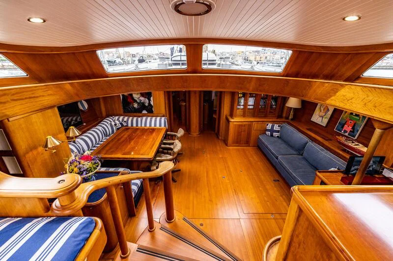 a room with a couch and a table aboard BOLERO Yacht for Sale