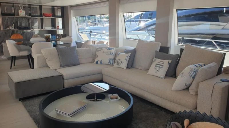 a living room with a large window aboard HANAVA Yacht for Sale