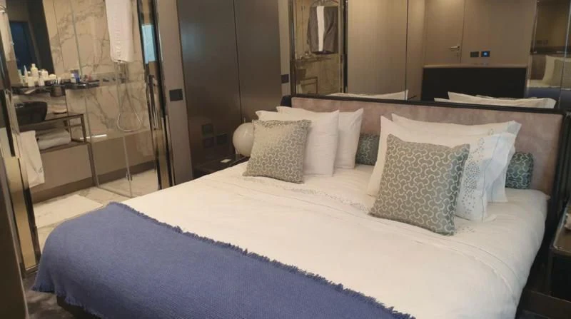a bed with pillows aboard HANAVA Yacht for Sale