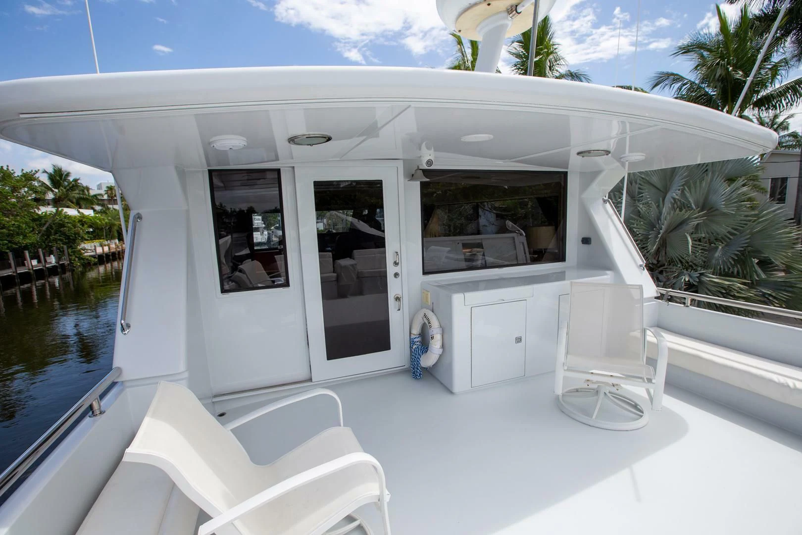 a white house with a pool aboard PAINKILLER Yacht for Sale