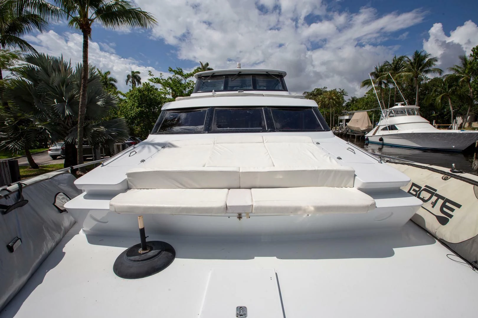 a white yacht parked on a white surface aboard PAINKILLER Yacht for Sale