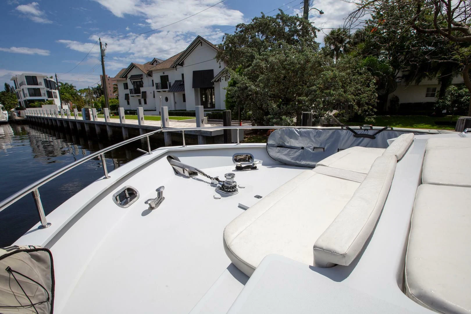 a white boat on a body of water aboard PAINKILLER Yacht for Sale