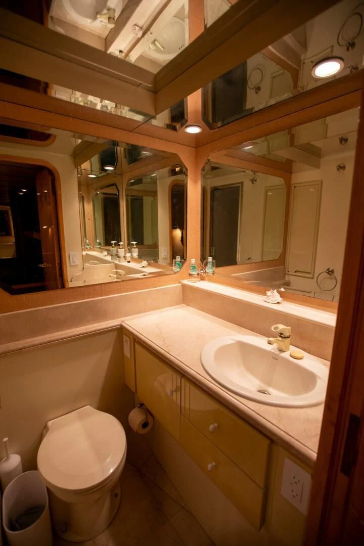 a bathroom with a sink and a toilet aboard PAINKILLER Yacht for Sale