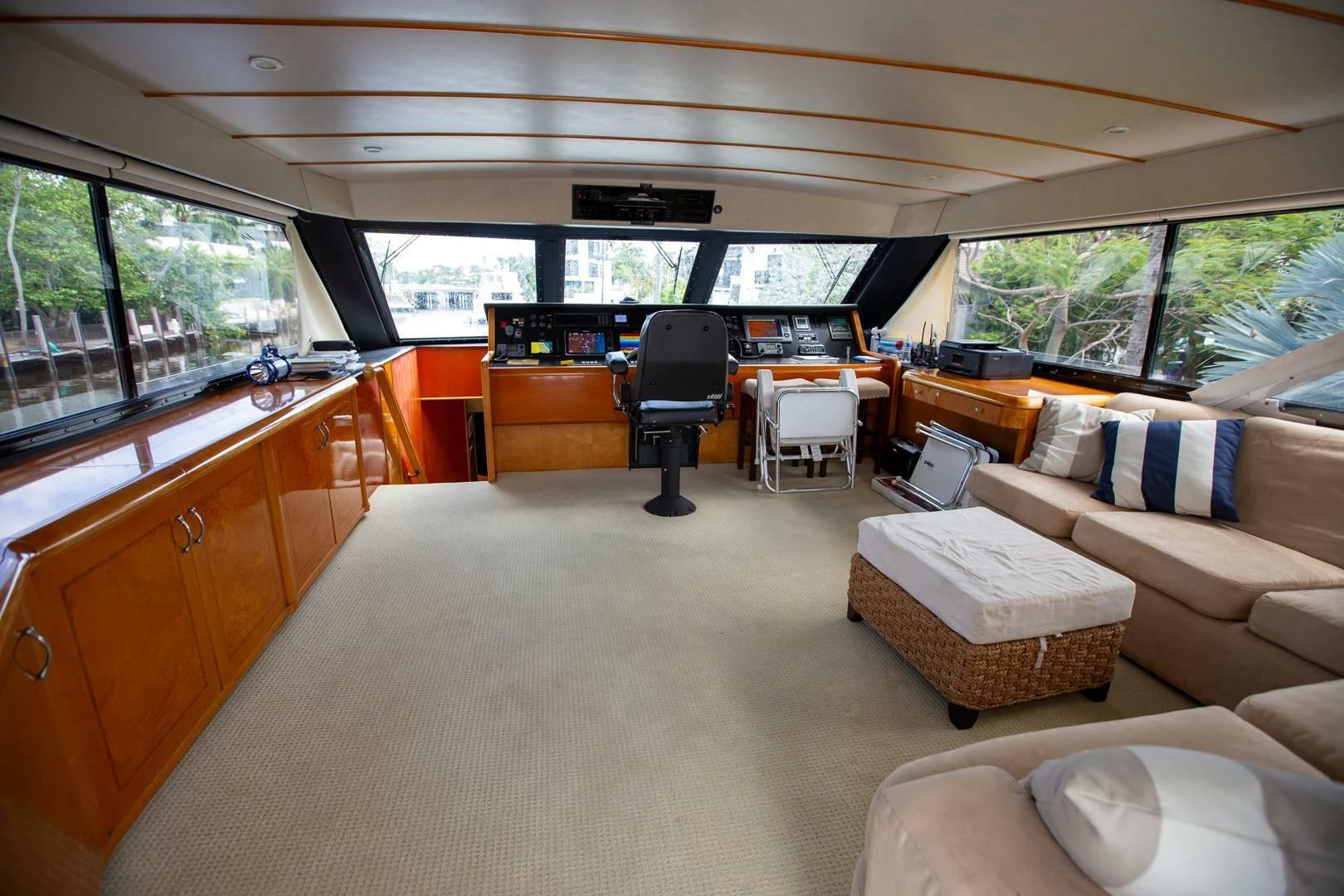 a living room with a couch and a table aboard PAINKILLER Yacht for Sale