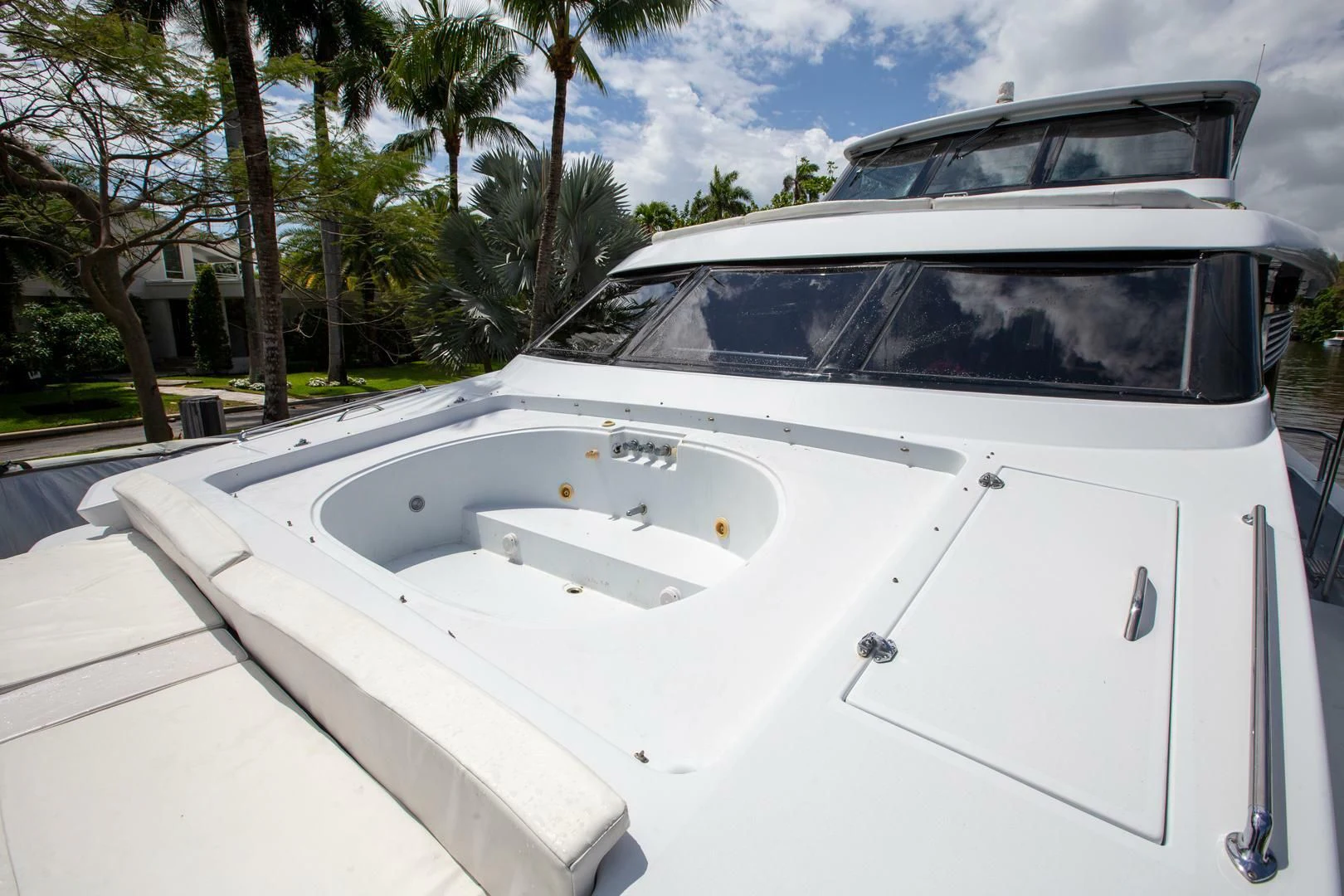 a white car parked on the side of the road aboard PAINKILLER Yacht for Sale