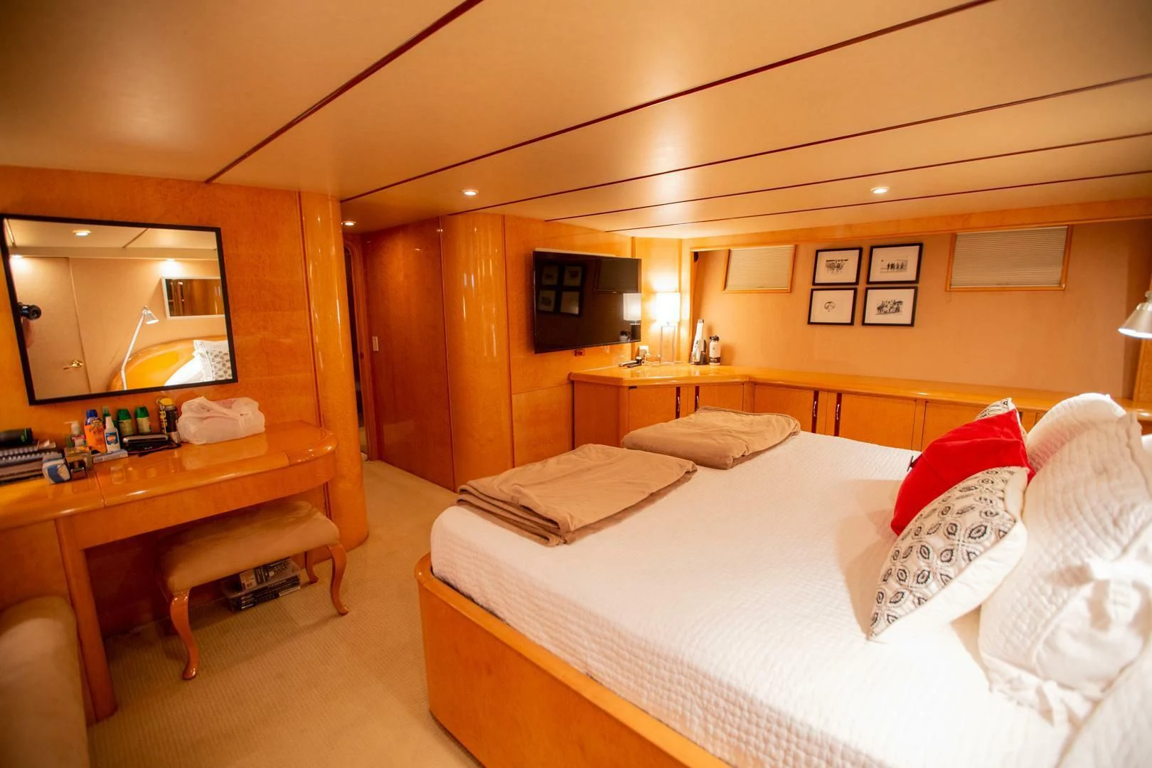a hotel room with a bed and a desk aboard PAINKILLER Yacht for Sale
